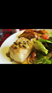 Lemon caper fish with homemade potshot wedges and salad